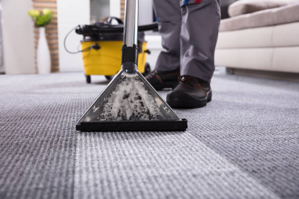 istock Person Cleaning Carpet With Vacuum Cleaner 949224818