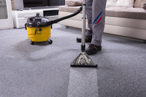 istock Person Cleaning Carpet With Vacuum Cleaner 949224822
