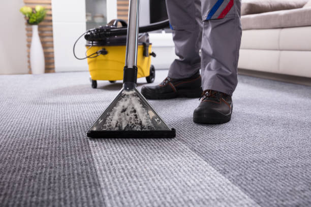 istock Person Cleaning Carpet With Vacuum Cleaner 949224848