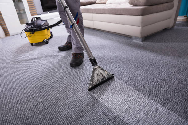 istock Person Cleaning Carpet With Vacuum Cleaner 949224850
