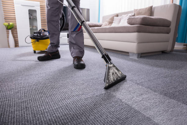 istock Person Cleaning Carpet With Vacuum Cleaner 949224870