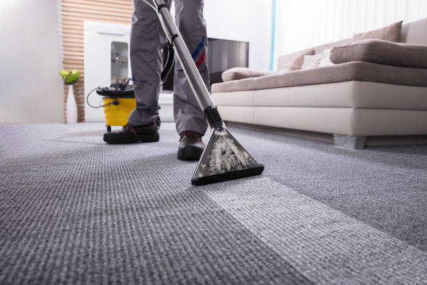 istock Person Cleaning Carpet With Vacuum Cleaner 949224872
