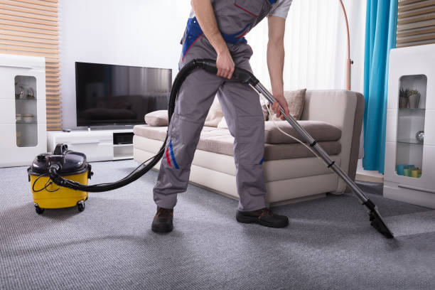 istock Person Cleaning Carpet With Vacuum Cleaner 949224880