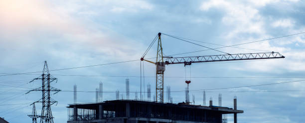 istock High rise building under construction, seen from below against blue sky. 949227950