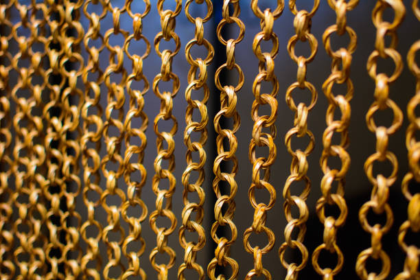 istock Beads from rings made from vines hang in a room 949231904