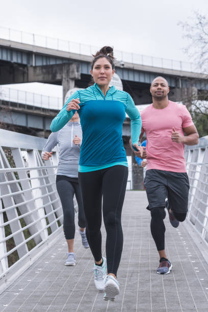 istock A group of co-ed runners goes for a training run in the city 949234434