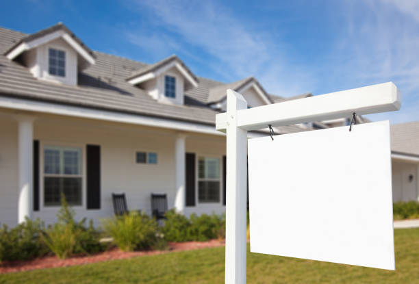 istock A new home with blank real estate signage 94923527