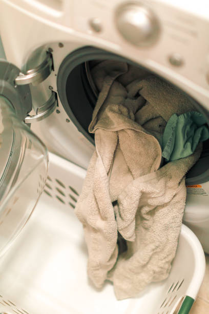 istock Doing laundry in laundry room of modern single family house 949236302