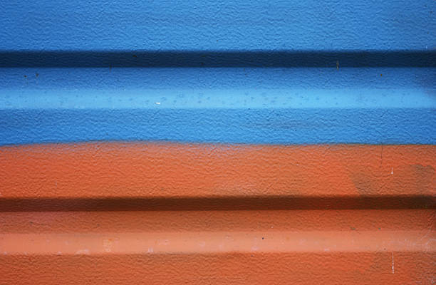 istock Metal garage door painted orange and blue background 94923690