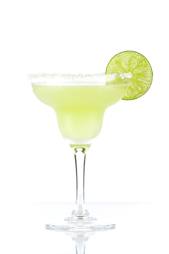 Classic margarita alcohol cocktail with lime slice isolated on white background