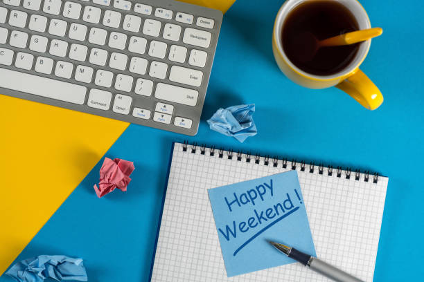istock Happy Weekend message in notebook on office desk with empty space for text, mockup or template 949238738