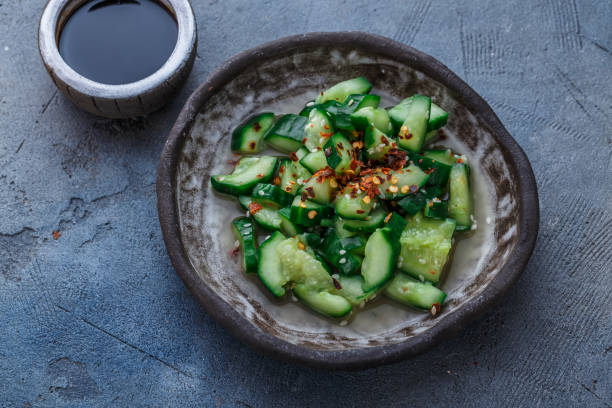istock Chinese beaten cucumbers salad, top view, dark background, place for text 949239070