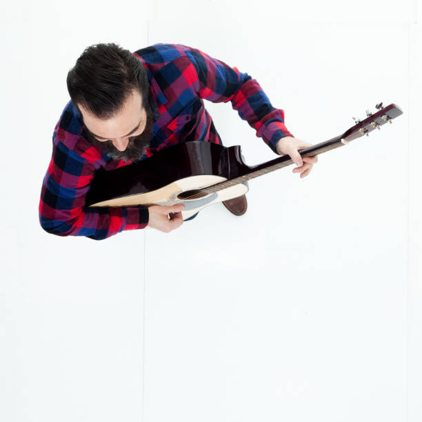 istock Directly above view of man playing guitar 949239284