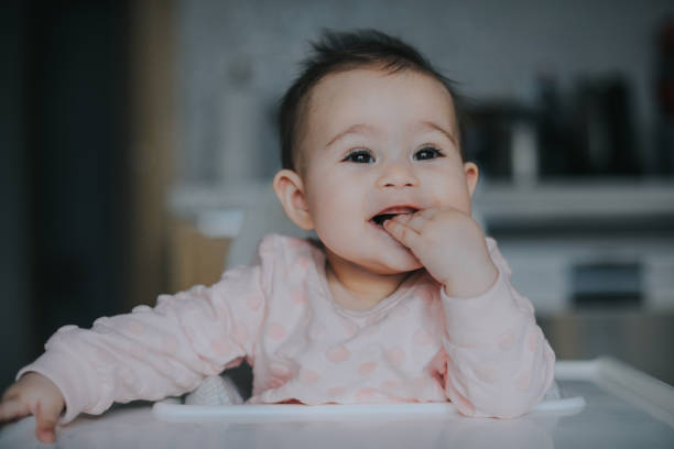 istock Adult feeding baby 949239552