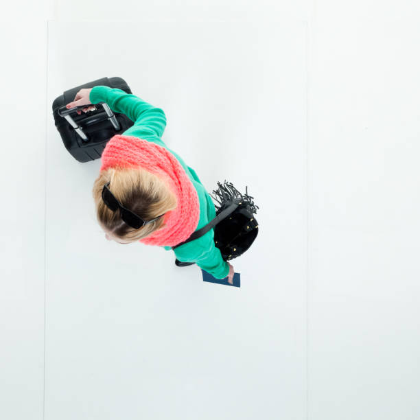 Top angle view of woman with suitcase