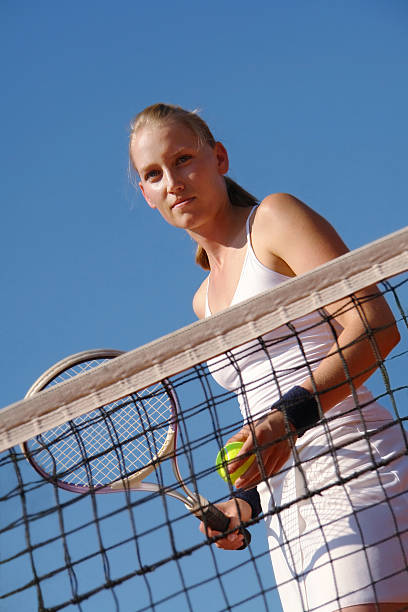 テニスコート - tennis serving female playing ストックフォトと画像