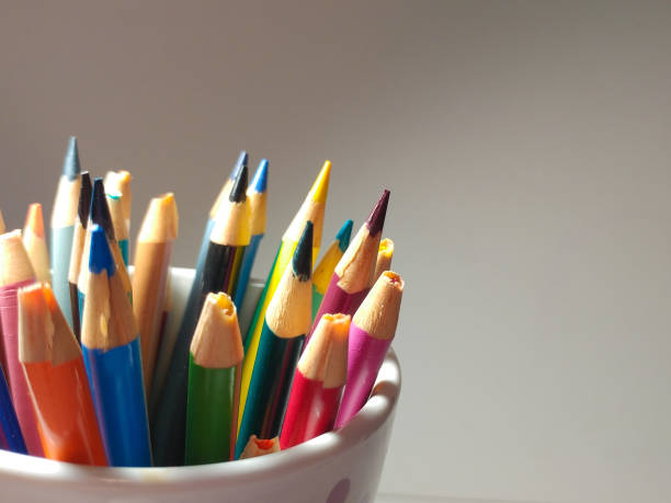 istock Sharpened Colored Pencils sticking out of a cup. 949244490