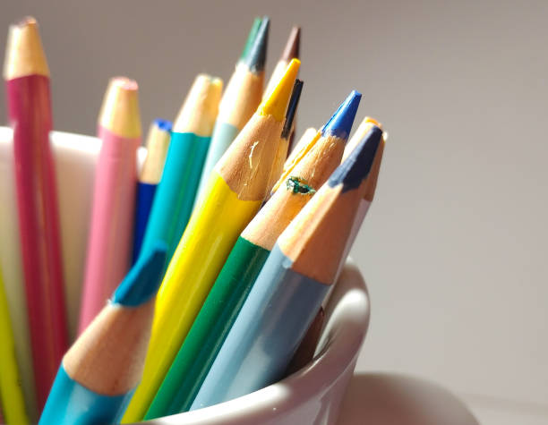 istock Sharpened Colored Pencils sticking out of a cup. 949244836