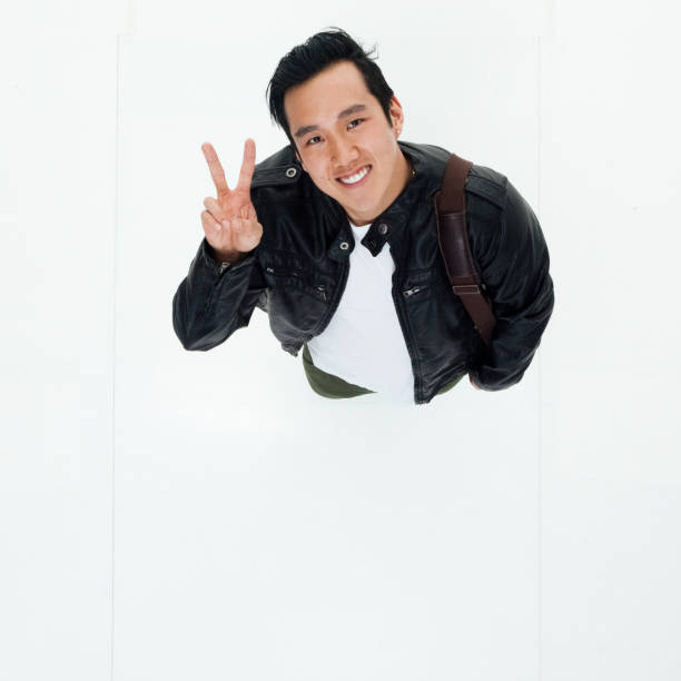 istock Top angle view of Korean man with peace sign 949245126