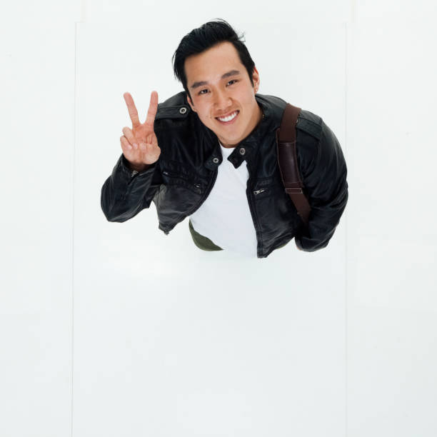 istock Top angle view of Korean man with peace sign 949245152