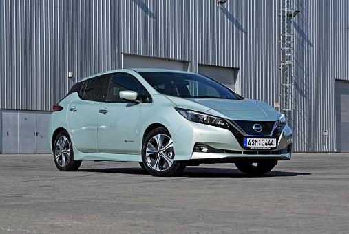 Prague, Czech Republic - 19th April, 2018: Zero emission Nissan Leaf stopped on the street. The Leaf model is the most popular electric compact car in Europe.