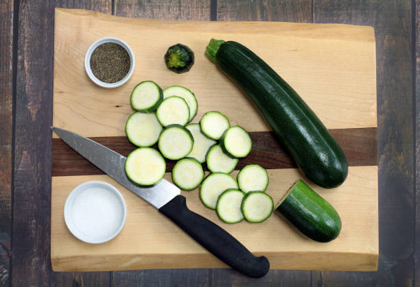 istock Fresh, organic zucchini.  Whole and sliced top view. 949251086