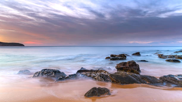istock Sunrise Seascape at the Beach with Clouds 949251966