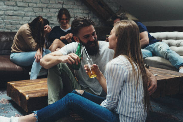istock Couple making beer toast 949252618