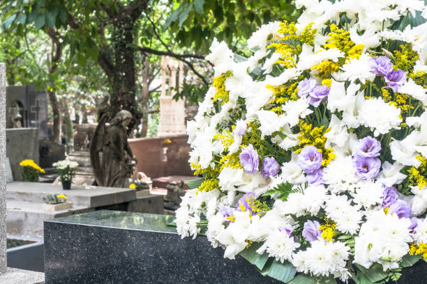 istock Natural flowers on a catholic tomb 949253090