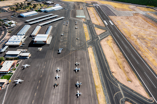An aerial view of the tarmac and runway of the Falcon Field Airport, a municipal airport located in the city of Mesa, Arizona, just outside Phoenix.