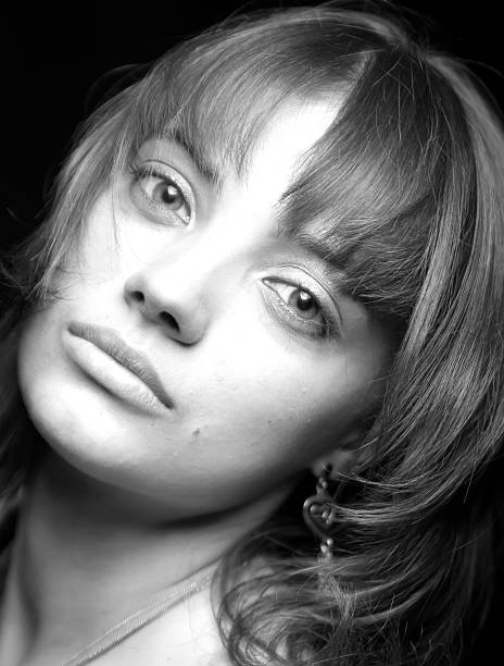 istock The sad beautiful girl on black background 94927456