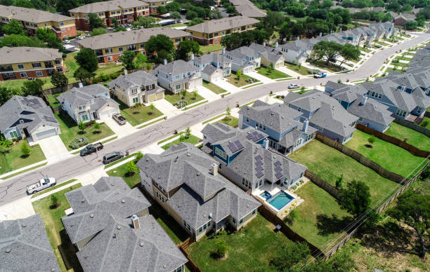 istock urban Suburb development North Austin homes and grey modern rooftops solar panels and swimming pool 949285884