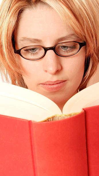 istock Blonde girl reading a book 94928735