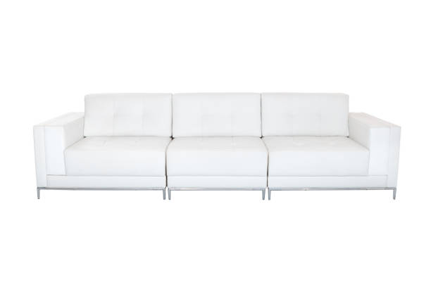 Terracotta color, leather couch with big yellow pillows