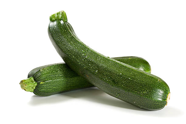 two fresh zucchini isolated  courgette stock pictures, royalty-free photos & images