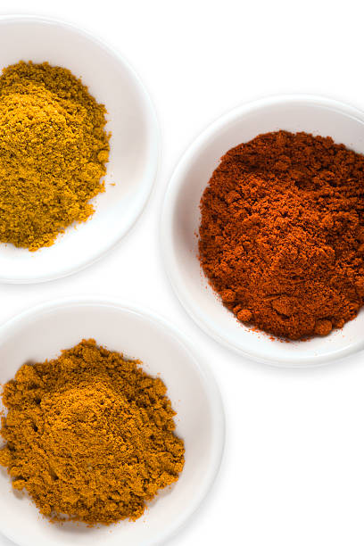 istock curry powder, ground turmeric and cayenne pepper in white bowls 94929721