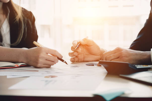 istock Business Team analyzing financial document and calculator on workplace - Corporate Organization Meeting Concept, Soft focus 949299380