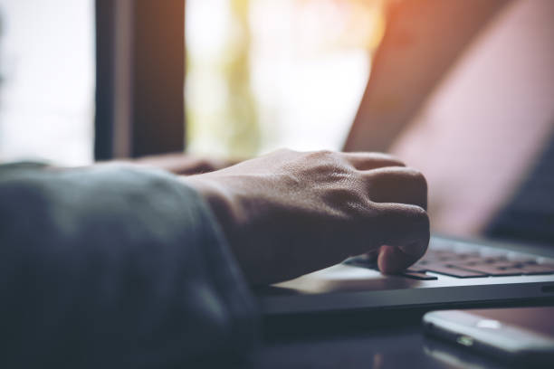 istock a business woman's hands working and typing on laptop keyboard 949303332