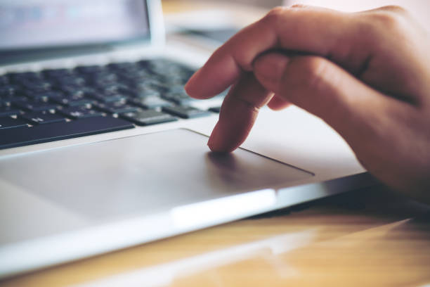istock a hand touching and typing on laptop keyboard 949306058