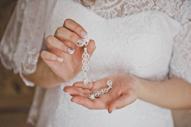 istock Jewelry in the womens hands 8865. 949309656
