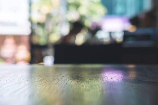 istock Wooden table in cafe with blur bokeh abstract vintage background 949309974