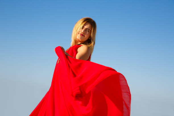 istock Woman in red 949324470