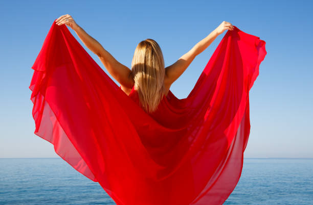 istock Woman in red 949324474