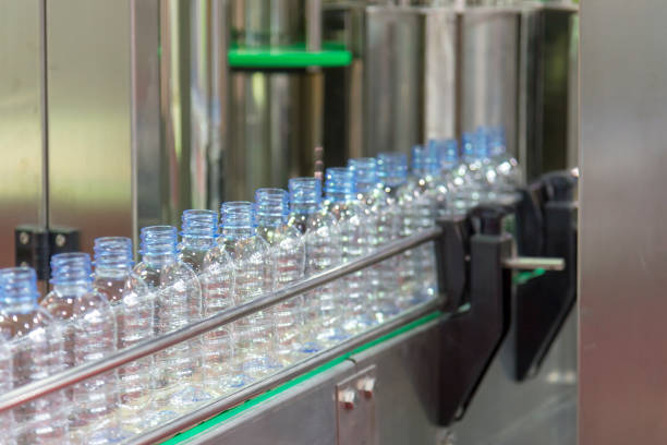 istock The new plastic bottles in the conveyor belt 949325426