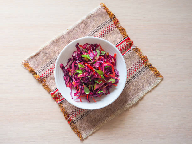 istock Red cabbage salad with apples and pecan nuts for Christmas dinner. Vegetarian dish. 949330876