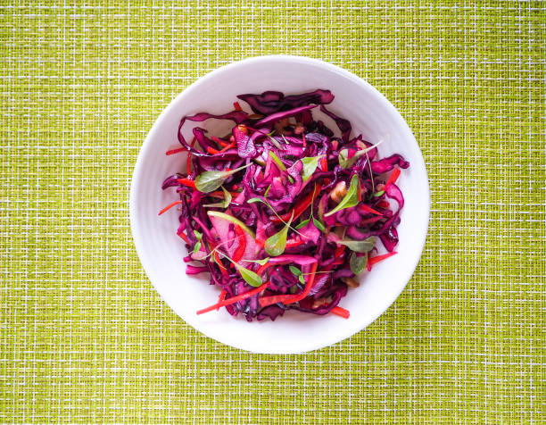 istock Red cabbage salad with apples and pecan nuts for Christmas dinner. Vegetarian dish. 949331538