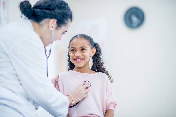 istock Checking Young Girl's Heartbeat 949331896