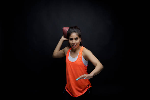 istock Cute female holding sports ball 949336896