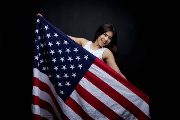 istock Businesswoman holding American flag 949337068