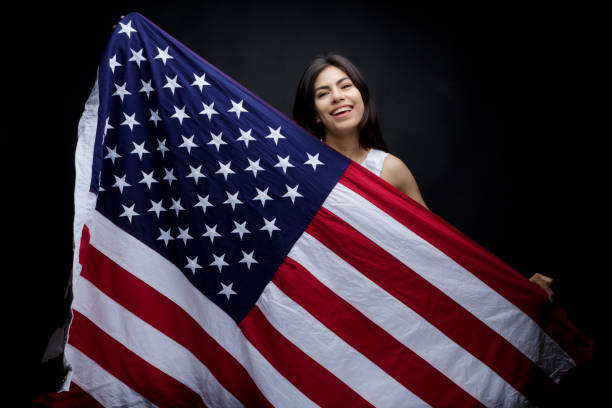 istock Businesswoman holding American flag 949337076